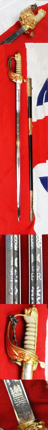A Near Mint British Royal Naval Offcer's Sword King George VIth Hilt and Mounts With The Upgraded Wilkinson Sword 1952-53 Deluxe Elizabeth IInd Coronation Blade, Of Mirror Bright & Frosted Polish. With Original Geo VIth Sword Knot