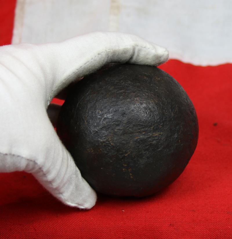 A Superb Original Waterloo Recovered Souvenir '6 Pounder ' Royal Artillery Cannon Ball Fired at La Haye Sainte During The Battle, Recovered From The Farm. With Clear impact Site To The Ball.