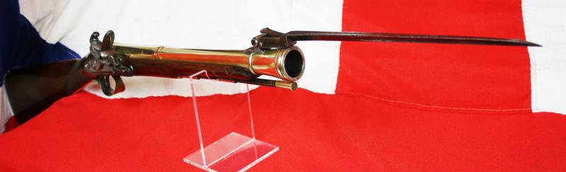 A Rare and Absolutely Spectacular, J. & W. Richards, All-Brass Flintlock Blunderbuss With Sprung Top Mounted Bayonet. Finest 'Juglans Regia' Walnut Stock. Circa 1800. Much Favoured by Ship's Captains