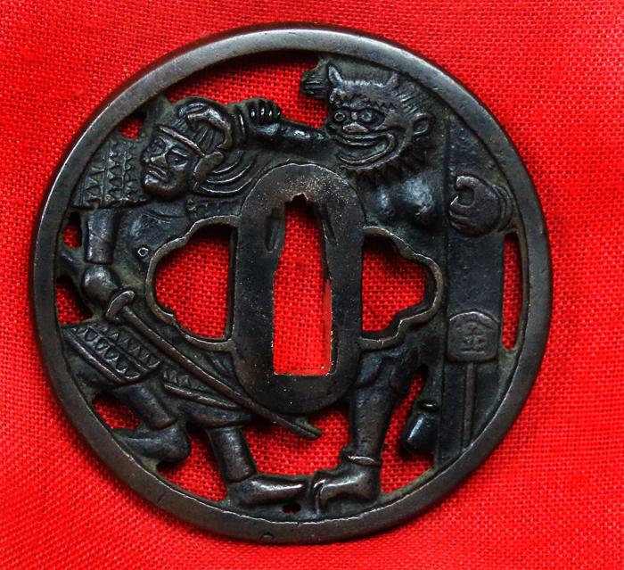 A Fine Shinto Period Handachi Mounted Armour & Kabuto Cleaving Katana Signed Nobutsugu, With a Fabulous Notare Hamon, Handachi Mounted with Tsuba Of Watanabe no Tsuna and The Rashomon Demon, Ibaraki-Dōji, At The Gate of the Modoribashi Bridge