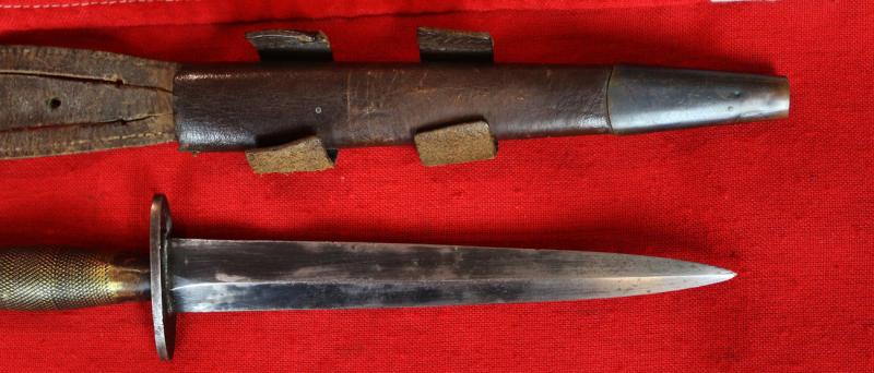 A Fabulous, WW2 Special Forces, 1942 Issue, 'B2' Broad Arrow Marked Early Second Pattern FS Commando Knife. With 'Hand Ground' Blued Finish Blade & Original Leather Scabbard In Great Service-Used Condition