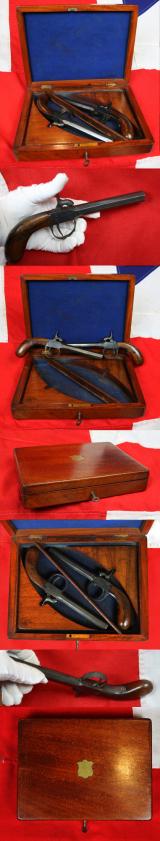 A Cased Pair Of Attractive, Antique, Victorian, Belgian Percussion Boxlock Pistols. A Pair of 'Barkers' Set in a Walnut Box Case In The French Style. Walnut Bag-Shaped Pistol Grips