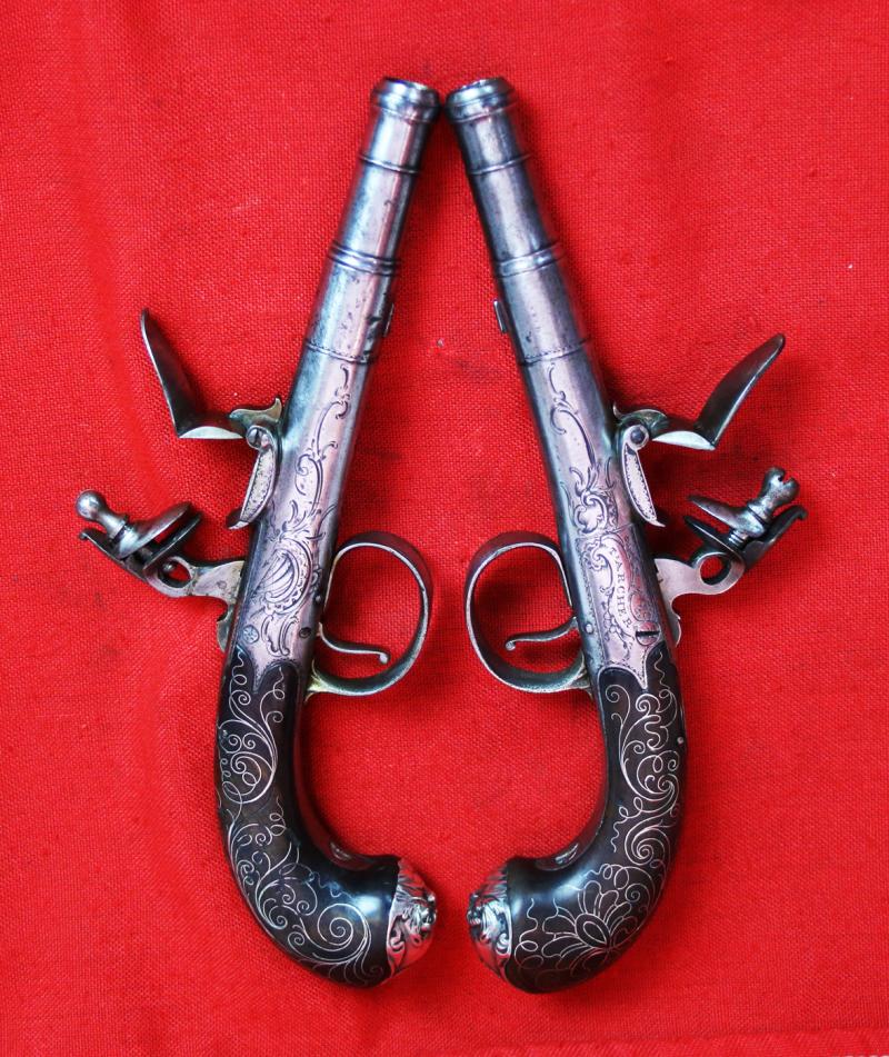 Absolutely Beautiful & Captivating Pair Of American Revolution Period 18th Century 'Queen Anne' Cannon Barrel Pistols with Silver Inlays & Solid Silver Grotesque Mask Butt Caps. Near Identical To Another Recovered From a Shipwreck off The Florida Coast