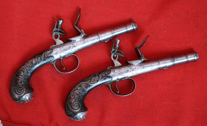 Absolutely Beautiful & Captivating Pair Of American Revolution Period 18th Century 'Queen Anne' Cannon Barrel Pistols with Silver Inlays & Solid Silver Grotesque Mask Butt Caps. Near Identical To Another Recovered From a Shipwreck off The Florida Coast