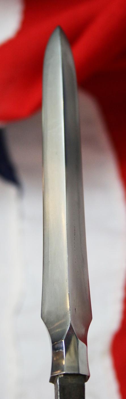 From the Roald Knutsen Collection. A Superb Hira Sankaku Yari Blade Signed Yamashiro no kami Kunishige 1751 in Superb Condition with fine Suguha Hamon, and an Horimono Cut Bo-Hi {Fuller} Decorated with Red Lacquer