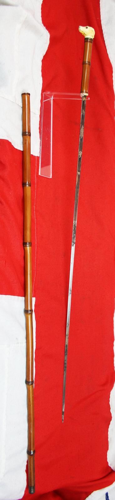 A Fine, Original, 19th Century Antique, King George IIIrd Carved Hound's Head Long Bladed Swordstick. Carved Ivory Head & Blue and Gilt Finely Engraved Steel Blade. Bamboo Wood