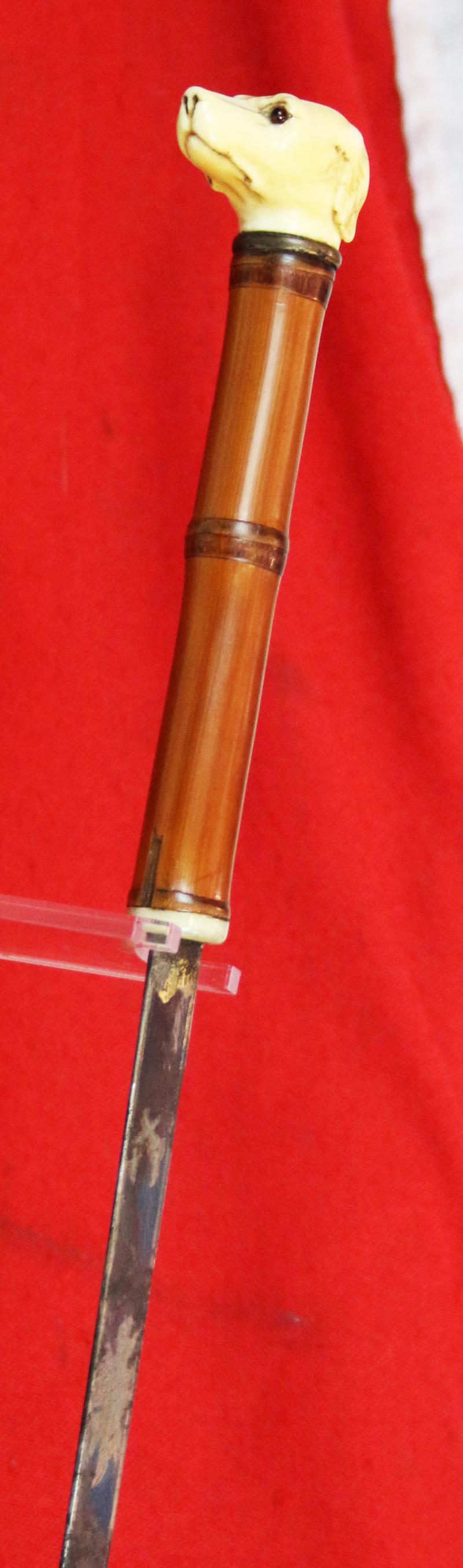 A Fine, Original, 19th Century Antique, King George IIIrd Carved Hound's Head Long Bladed Swordstick. Carved Ivory Head & Blue and Gilt Finely Engraved Steel Blade. Bamboo Wood