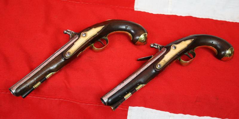 A Very Fine Pair of 1770's Gentleman' or Officers Holster Pistols. Fine Juglans Regia Walnut Stocks, All Brass Cast Furniture Mounts Beautifully Engraved. Bright Steel Barrels & Flintlocks Signed Waters & Ward