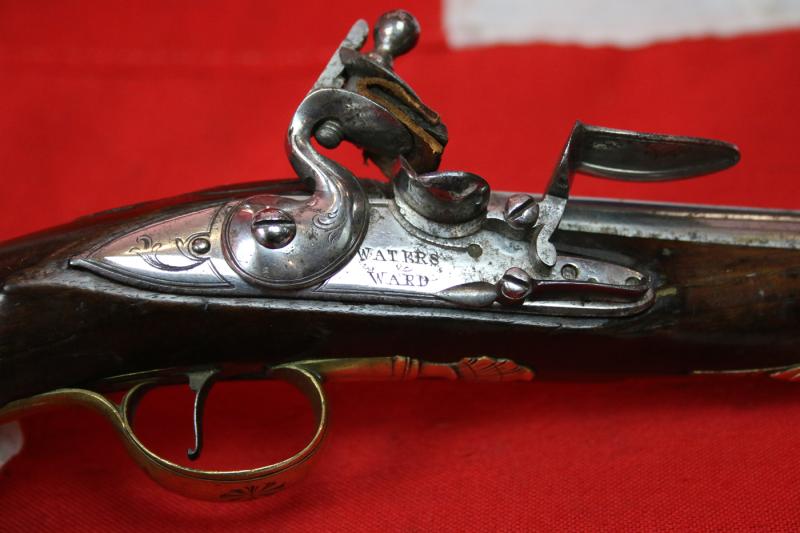 A Very Fine Pair of 1770's Gentleman' or Officers Holster Pistols. Fine Juglans Regia Walnut Stocks, All Brass Cast Furniture Mounts Beautifully Engraved. Bright Steel Barrels & Flintlocks Signed Waters & Ward
