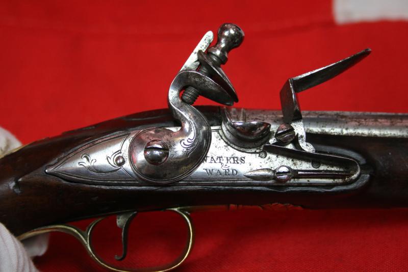 A Very Fine Pair of 1770's Gentleman' or Officers Holster Pistols. Fine Juglans Regia Walnut Stocks, All Brass Cast Furniture Mounts Beautifully Engraved. Bright Steel Barrels & Flintlocks Signed Waters & Ward