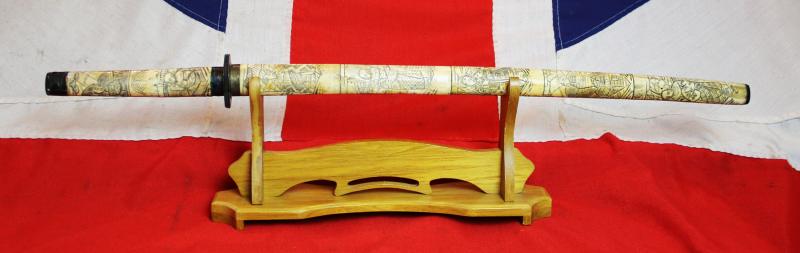 A Late 19th Century Most Attractive Hand Carved Japanese Samurai Style Export Sword From the Late Edo to Taisho Period. Decorated Throughout With Takebori Carved Figures of Armoured Samurai & Nobles In Court Dress